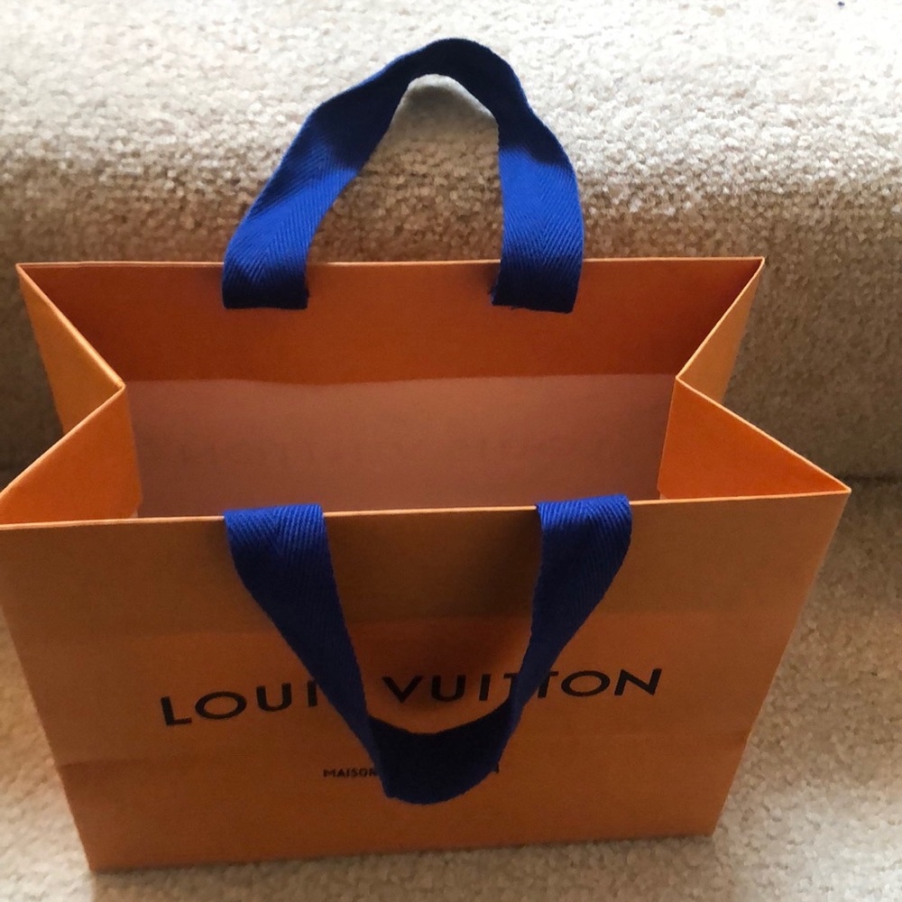 Louis Vuitton gift bag with handles and blue ribbon